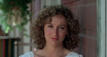 Movie still from “Dirty Dancing” (1987), directed by Emile Ardolino – A person with curly hair; Close Up shot, Low angle