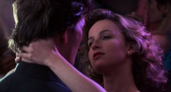 Movie still from “Dirty Dancing” (1987), directed by Emile Ardolino – A man and a woman are looking into each others eyes; Close Up shot, Over the shoulder angle
