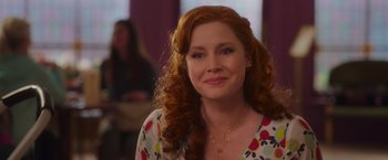 Movie still from “Disenchanted” (2022), directed by Adam Shankman – A person with curly hair; Close Up shot, Over the shoulder angle