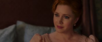 Movie still from “Disenchanted” (2022), directed by Adam Shankman – A person sitting on a bed; Close Up shot, Over the shoulder angle