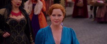Movie still from “Disenchanted” (2022), directed by Adam Shankman – A red headed woman wearing a blue dress; Close Up shot, Over the shoulder angle