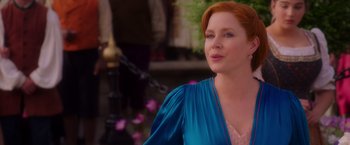 Movie still from “Disenchanted” (2022), directed by Adam Shankman – A red headed woman wearing a blue dress; Close Up shot, Over the shoulder angle