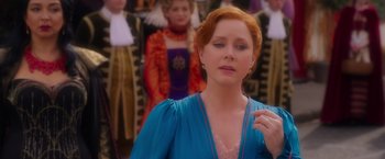 Movie still from “Disenchanted” (2022), directed by Adam Shankman – A red headed woman in a blue dress; Close Up shot, Over the shoulder angle