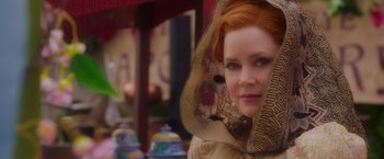 Movie still from “Disenchanted” (2022), directed by Adam Shankman – A woman with red hair wearing a veil; Close Up shot, Over the shoulder angle