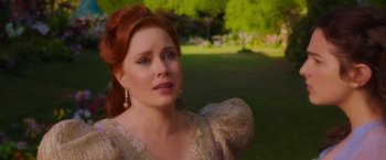Movie still from “Disenchanted” (2022), directed by Adam Shankman – A woman with red hair wearing a white dress; Close Up shot, Over the shoulder angle