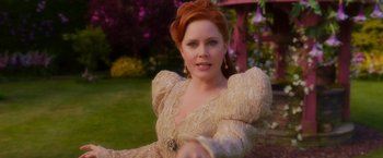 Movie still from “Disenchanted” (2022), directed by Adam Shankman – A woman with red hair wearing a white dress; Close Up shot, Over the shoulder angle