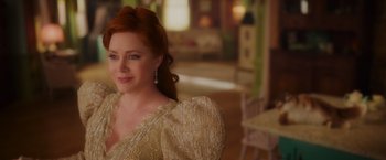 Movie still from “Disenchanted” (2022), directed by Adam Shankman – A woman with red hair wearing a white dress; Close Up shot, Over the shoulder angle