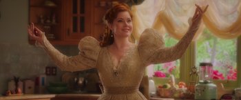 Movie still from “Disenchanted” (2022), directed by Adam Shankman – A woman with red hair in a white dress; Medium shot, Low angle
