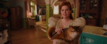 Movie still from “Disenchanted” (2022), directed by Adam Shankman – A woman holding a cat in her arms; Close Up shot, Over the shoulder angle