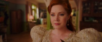 Movie still from “Disenchanted” (2022), directed by Adam Shankman – A person with red hair wearing a dress; Close Up shot, Over the shoulder angle