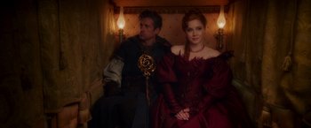 Movie still from “Disenchanted” (2022), directed by Adam Shankman – A man and a woman dressed in medieval garb; Medium shot, Over the shoulder angle