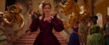 Movie still from “Disenchanted” (2022), directed by Adam Shankman – A woman dressed in a red dress and a crown; Medium shot, Low angle
