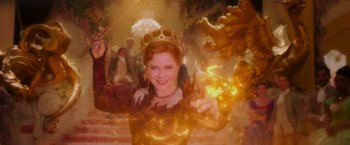 Movie still from “Disenchanted” (2022), directed by Adam Shankman – A woman wearing a crown and holding a wand; Close Up shot, Low angle