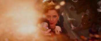 Movie still from “Disenchanted” (2022), directed by Adam Shankman – A person wearing a crown and holding something; Close Up shot, Over the shoulder angle