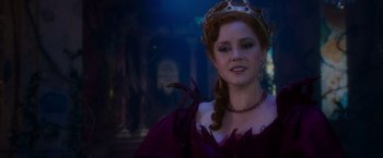 Movie still from “Disenchanted” (2022), directed by Adam Shankman – A woman in a purple dress wearing a crown; Close Up shot, Over the shoulder angle