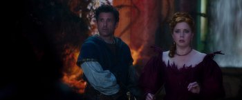Movie still from “Disenchanted” (2022), directed by Adam Shankman – A man and a woman dressed in medieval garb; Medium shot, Over the shoulder angle