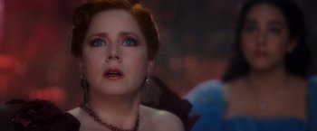 Movie still from “Disenchanted” (2022), directed by Adam Shankman – A person wearing a necklace; Close Up shot, Over the shoulder angle