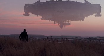 Movie still from “District 9” (2009), directed by Neill Blomkamp – An image of a man looking out at the sky; Extreme Wide shot, Low angle