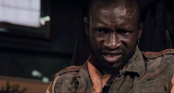 Movie still from “District 9” (2009), directed by Neill Blomkamp – A person wearing a jacket; Close Up shot, Low angle