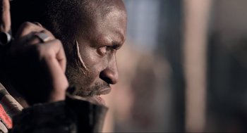 Movie still from “District 9” (2009), directed by Neill Blomkamp – A man's face and his ear; Close Up shot, Low angle