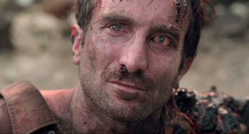 Movie still from “District 9” (2009), directed by Neill Blomkamp – A person with dirt on his face; Close Up shot, Low angle