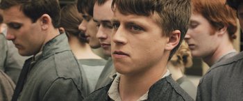 Movie still from “Divergent” (2014), directed by Neil Burger – A group of young men standing next to each other; Close Up shot, Low angle