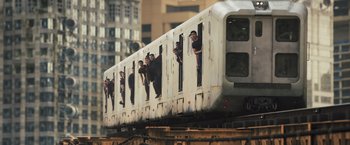 Movie still from “Divergent” (2014), directed by Neil Burger – A group of people hanging out of a train window; Extreme Wide shot, Low angle