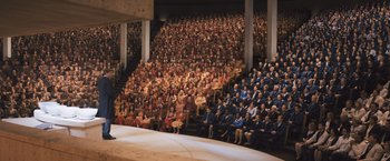 Movie still from “Divergent” (2014), directed by Neil Burger – A large group of people sitting in a large auditorium; Extreme Wide shot, High angle