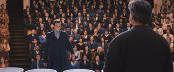 Movie still from “Divergent” (2014), directed by Neil Burger – A crowd of people sitting in front of each other in a room; Wide shot, High angle