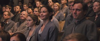 Movie still from “Divergent” (2014), directed by Neil Burger – A group of people sitting in front of each other; Medium shot, Over the shoulder angle