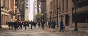 Movie still from “Divergent” (2014), directed by Neil Burger – A group of people walking down a street; Extreme Wide shot, High angle