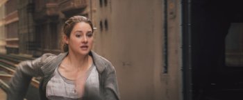 Movie still from “Divergent” (2014), directed by Neil Burger – A person walking down a street; Close Up shot, Over the shoulder angle
