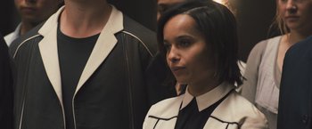 Movie still from “Divergent” (2014), directed by Neil Burger – A person wearing a suit and tie; Close Up shot, Over the shoulder angle