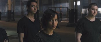 Movie still from “Divergent” (2014), directed by Neil Burger – A man and a woman standing next to each other in a room; Close Up shot, High angle