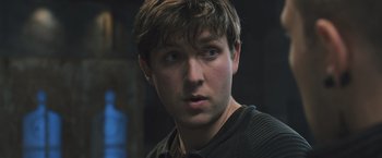 Movie still from “Divergent” (2014), directed by Neil Burger – A person wearing a sweater; Close Up shot, Low angle