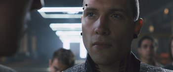 Movie still from “Divergent” (2014), directed by Neil Burger – A person wearing a jacket; Close Up shot, Low angle