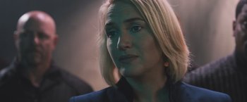 Movie still from “Divergent” (2014), directed by Neil Burger – A person with blonde hair; Close Up shot, Over the shoulder angle
