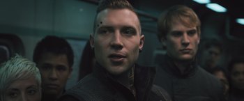 Movie still from “Divergent” (2014), directed by Neil Burger – A person wearing a jacket; Close Up shot, Over the shoulder angle