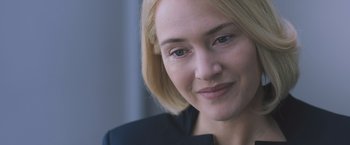 Movie still from “Divergent” (2014), directed by Neil Burger – A person with blonde hair; Close Up shot, Over the shoulder angle