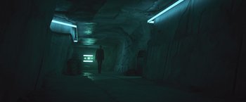 Movie still from “Divergent” (2014), directed by Neil Burger – A man is walking in a dark tunnel; Wide shot, Low angle