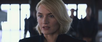 Movie still from “Divergent” (2014), directed by Neil Burger – A person with blonde hair; Close Up shot, Over the shoulder angle