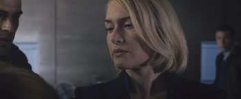 Movie still from “Divergent” (2014), directed by Neil Burger – A woman with blonde hair wearing a black jacket; Close Up shot, Low angle