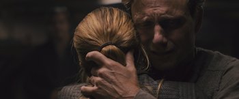 Movie still from “Divergent” (2014), directed by Neil Burger – A man holding a woman's hair in her arms; Close Up shot, Over the shoulder angle