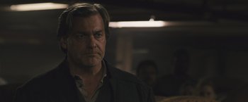 Movie still from “Divergent” (2014), directed by Neil Burger – A person wearing a jacket; Close Up shot, Over the shoulder angle