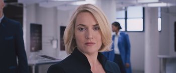 Movie still from “Divergent” (2014), directed by Neil Burger – A woman with blonde hair wearing a black jacket; Close Up shot, Low angle