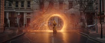 Movie still from “Doctor Strange” (2016), directed by Scott Derrickson – A man in a yellow robe is holding a sword; Extreme Wide shot, Over the shoulder angle