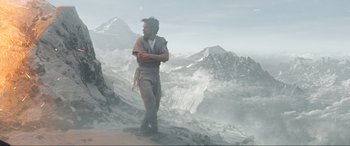 Movie still from “Doctor Strange” (2016), directed by Scott Derrickson – A man standing on top of a mountain with mountains in the background; Wide shot, Low angle