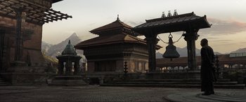 Movie still from “Doctor Strange” (2016), directed by Scott Derrickson – An image of an old building in the middle of the day; Extreme Wide shot, High angle