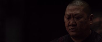 Movie still from “Doctor Strange” (2016), directed by Scott Derrickson – An older man is looking down at his face; Close Up shot, Low angle