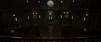 Movie still from “Doctor Strange” (2016), directed by Scott Derrickson – A dark hallway with a clock on the wall; Extreme Wide shot, High angle